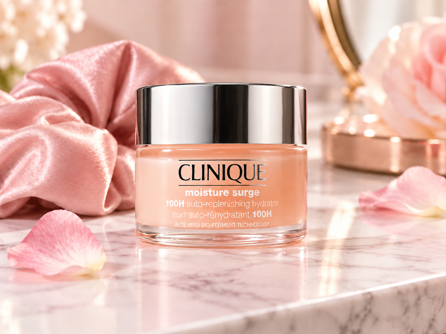 Clinique Moisture Surge hydrator displayed in a soft pink luxury beauty setting on a marble surface.